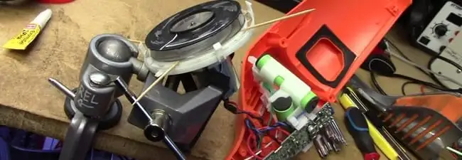 Vacuum cleaner repair parts and tools on a workbench in Eugene, OR